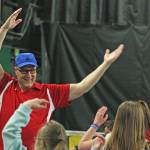 Club member and youth coach Daryl Harper warms up the players with the music of &ldquo;YMCA&rdquo;. MARK KLAAS, Kent Reporter