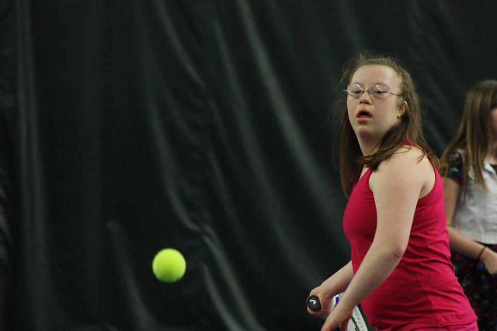 Maeson Harper takes aim to return a shot during camp at the Boeing Employees Tennis Center last Saturday. MARK KLAAS, Kent Reporter