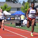 Jaleesa Taylor darts to the end of the 400-meter relay. The Kent-Meridian foursome finished sixth in 49.14. RACHEL CIAMPI, Reporter
