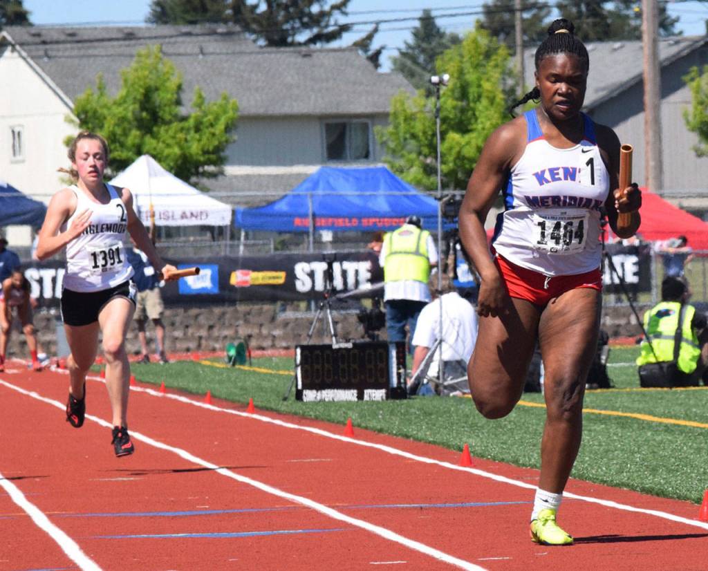 Jaleesa Taylor darts to the end of the 400-meter relay. The Kent-Meridian foursome finished sixth in 49.14. RACHEL CIAMPI, Reporter