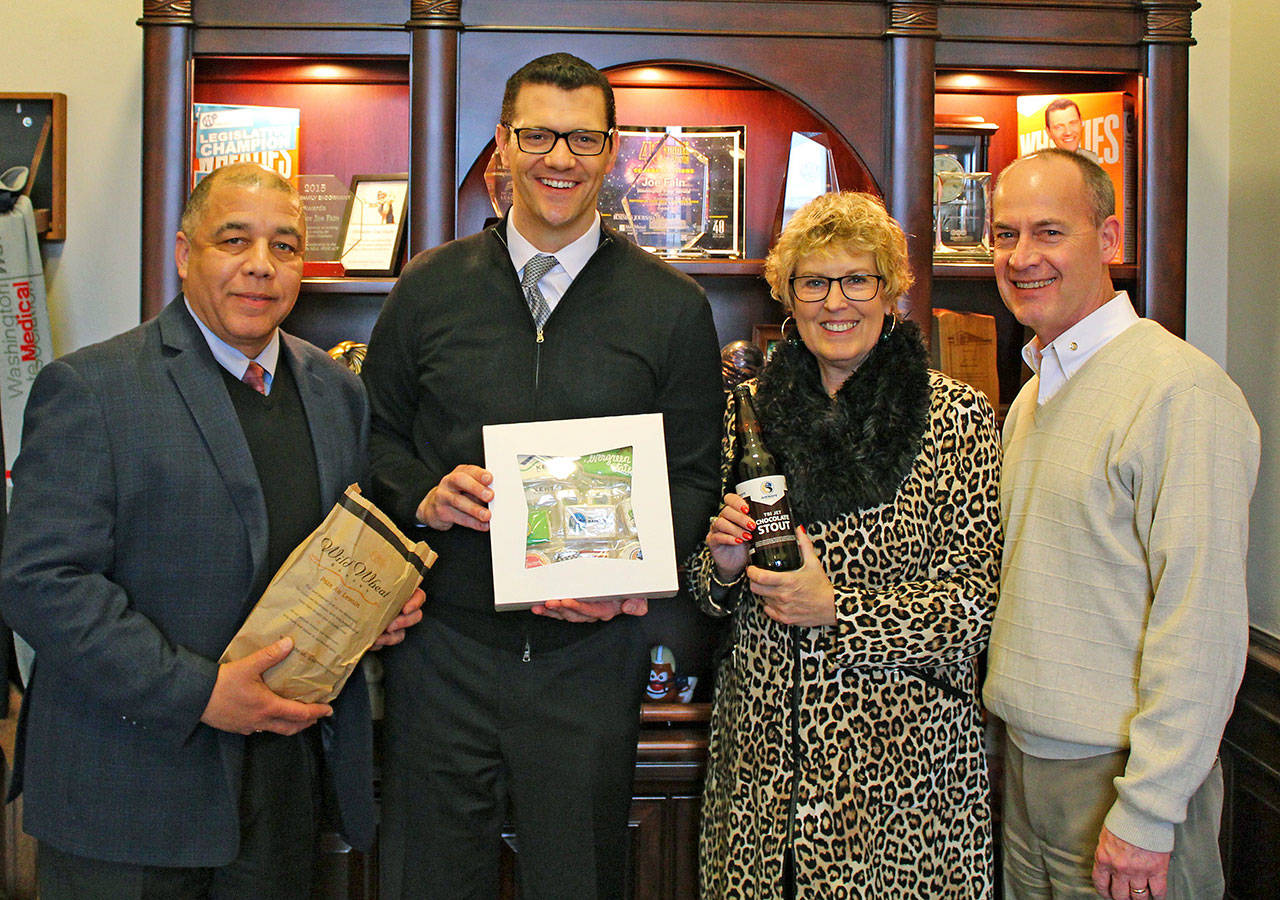 The Senate approved legislation to improve opportunities for main street businesses, co-sponsored by Sen. Joe Fain, R-Auburn, second from the left. Earlier this year, Randall Smith, far left, Barbara Smith and Greg Haffner, far right, of the Kent Downtown Partnership were in Olympia this week to advocate for the legislation to better support main street community businesses. COURTESY PHOTO, Washington State Legislature