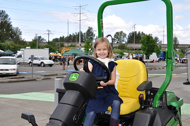 Children can check out city vehicles at the annual Public Works Week at the ShoWare Center in Kent as this girl did in 2016.