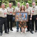 Cathy Lynch, an employee in the Kent School District&rsquo;s transportation department, recently received the Washington Department of Fish and Wildlife&rsquo;s Terry Hoffer award. She is joined by Washington Department of Fish and Wildlife (WDFW) hunter education and volunteer coordinator staff. From left, are Aaron Garcia, Mike Whorton, division manager Dave Whipple, Lynch, Lynch&rsquo;s coordinator Steven Dazey and Chuck Ray. COURTESY PHOTO, WDFW