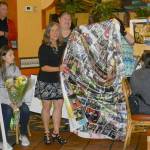 Cathy Brasher-Hwang, who retired this year as coach of the Kent Storm Special Olympics Team, receives a photo blanket in honor of her 10 years coaching the team. COURTESY PHOTO, Jaleesa La Croix