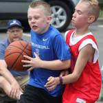 Jackson Whitaker of Liberty Blue drives on Grayson Frederick of the 26ers during fourth-grade boys division play during last year&rsquo;s ShoWare Shootout. MARK KLAAS, Kent Reporter