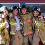 John Whitmore, left, Diego Santiago, Justin Thompson and Tyanna Cole of Zone 3 Explorers strike a pose at Maple Valley Fire Station 81. LEAH ABRAHAM, The Reporter