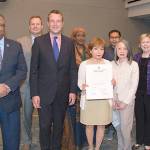 Representatives from several immigration groups join a County Council members Larry Gossett, far left, Dave Upthegrove, second from left, and Joe McDermott, third from left, after the council proclaimed June as Immigrant Heritage Month in King County.