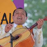 Salvador Morales, of the Mariachi Conquistadors de Mexico, strums a number during the group&rsquo;s performance on the Plaza Stage at the Kent International Festival at the ShoWare Center on Saturday. MARK KLAAS, Kent Reporter