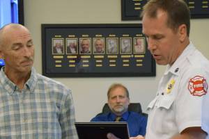 Kent man receives award for rescuing woman from duplex fire