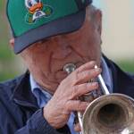 Bert Barr blows his trumpet as he entertains passers-by during the opening of the Kent Farmers Market at the Town Square Plaza on Saturday. Bert plays trumpet and percussion and his wife, Rose Marie, plays piano. Together, the Double Barrs perform jazz and swing music from yesteryear. MARK KLAAS, Kent Reporter