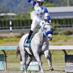 Eswan Flores exults after guiding Riser to a resounding win in the $50,000 Coca-Cola Stakes for 3-year-old colts and geldings on Sunday. COURTESY PHOTO, Emerald Downs.