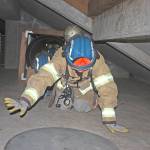 Cadet Kehaulani Planesi, A Company leader, leads her team on a search-and-rescue mission in a damaged, abandoned building on the Puget Sound Regional Fire Authority&rsquo;s training center during a fire school for teens last week. MARK KLAAS, Kent Reporter