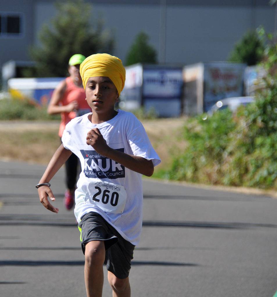 Auburn’s Flannery scoots to victory in festival 5K race | PHOTOS