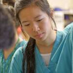 Emily Huynh, who will be a junior at Kentridge High School in the fall, observes a CPR/first aid demonstration during Multicare Nurse Camp last Friday. Huynh said she is considering becoming a surgeon. MARK KLAAS, Kent Reporter