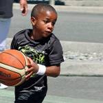 Young sharpshooting guard J&rsquo;Shaun Wilson of Team Flight takes possession. MARK KLAAS, Kent Reporter