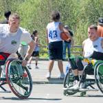 Stuart Olson of Seattle Tonic, looks for an opening against the Odd Squad in wheelchair division play. MARK KLAAS, Kent Reporter
