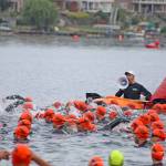 Swimmers in the Olympic division of the Lake Meridian Triathlon start their 1.5-kilometer swim last Saturday morning. More than 520 individuals and more than 20 relay teams competed in the eighth annual event, which includes swimming, biking and running. MARK KLAAS, Kent Reporter