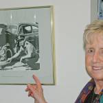 Vicki Schmitz points out her father Robert E. Lee, former Kent Police chief, in a photo displayed at the Kent Police station. Steve Hunter/KentReporter