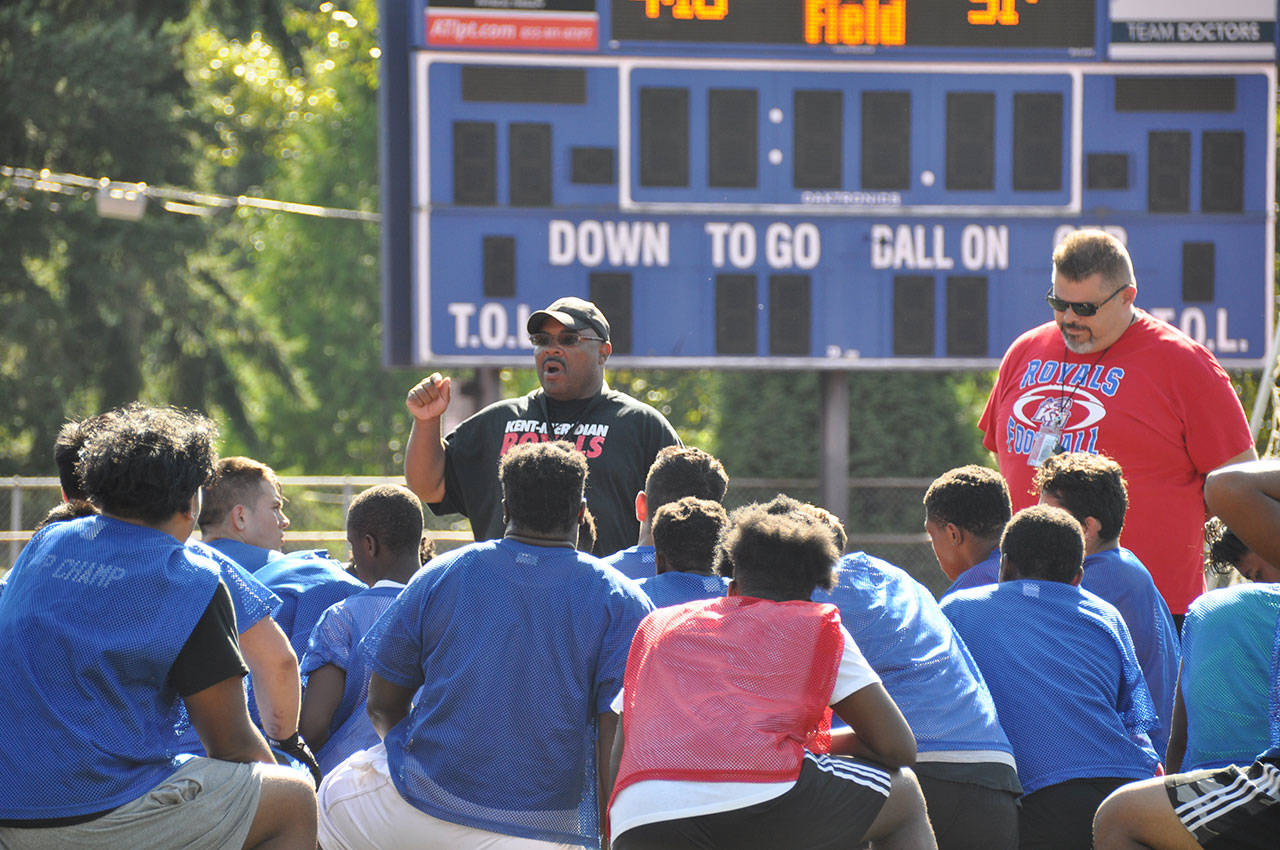 New Kent-Meridian High coach Jeff Scott talks to his team after Monday&rsquo;s practice at French Field. HEIDI SANDERS, Kent Reporter
