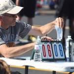A scorekeeper stays busy. MARK KLAAS, Auburn Reporter