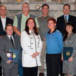 Secretary of State Kim Wyman, third from left, front row, and past winners of the business award. COURTESY PHOTO