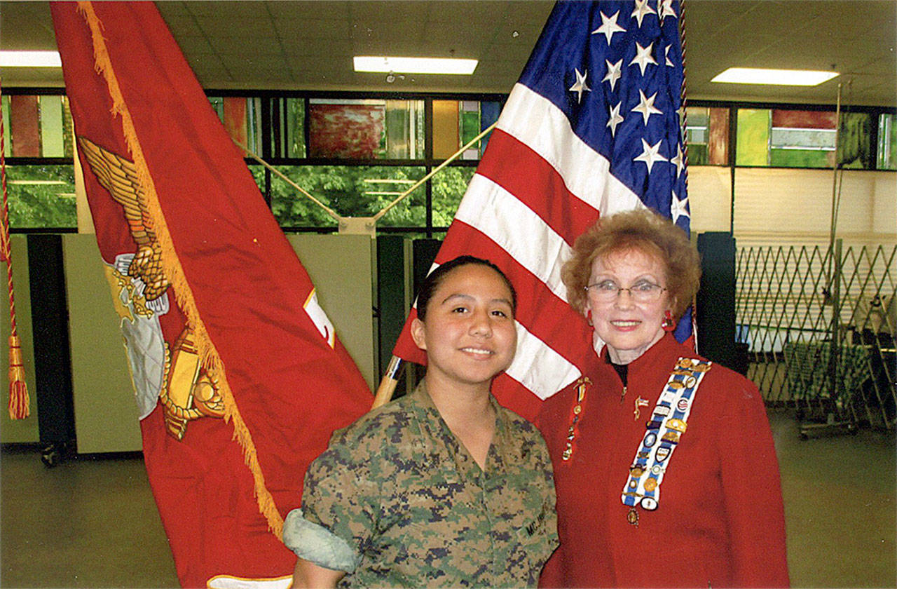 Hilda Meryhew, of the Lakota Chapter, National Defense, right, presents the honor to Cadet Makayla Abeyta at Kentwood High School. COURTESY PHOTO