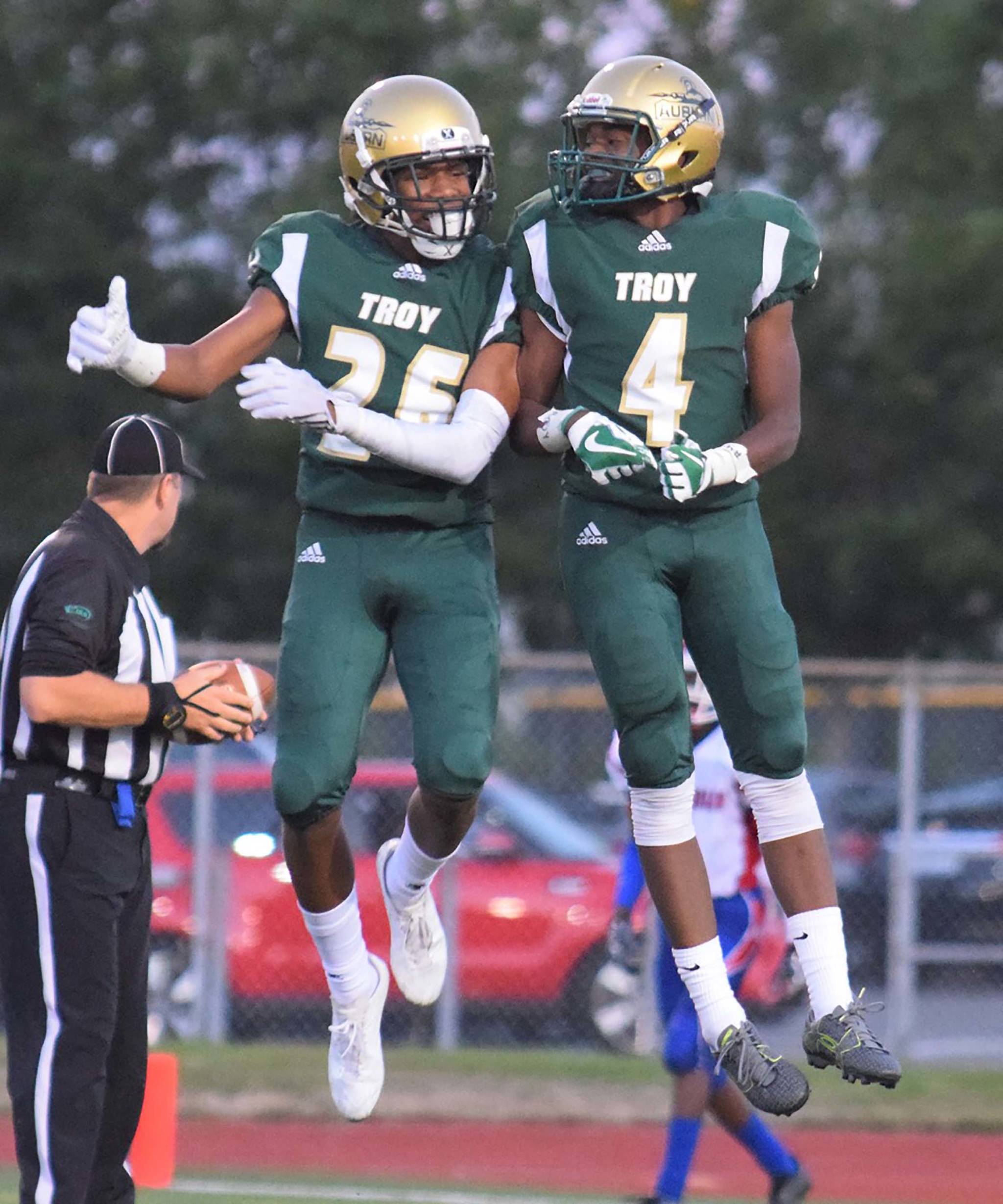 Auburn&rsquo;s Aadam Rasheed, left, and Zeke Turner celebrate a touchdown during Auburn&rsquo;s 62-28 NPSL win over rival Kent-Meridian on Friday night. RACHEL CIAMPI, Auburn Reporter
