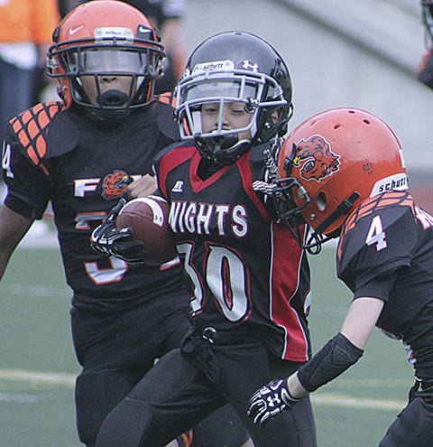 Jayden Barrett battles for yardage. MARK KLAAS, Kent Reporter