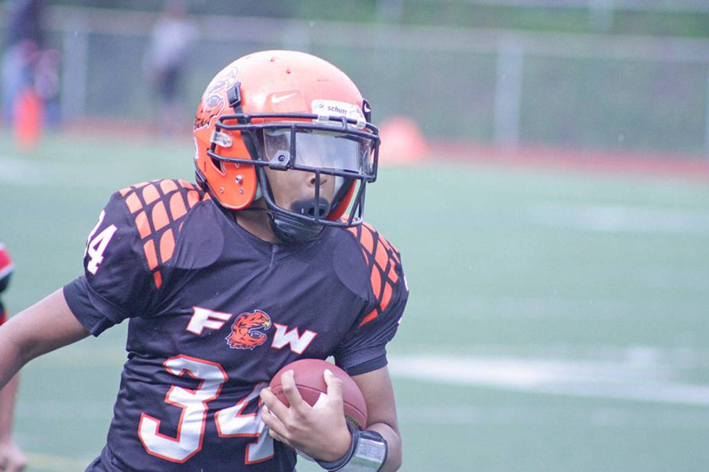 The Hawks&rsquo; Jadeon Scranton Jr. darts to a touchdown. MARK KLAAS, Kent Reporter