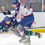 The Thunderbirds&rsquo; Sami Moilanen, left, and the Americans&rsquo; Jordan Topping collide on the ice during season-opening WHL play Saturday night. COURTESY PHOTO, Brian Liesse, T-Birds