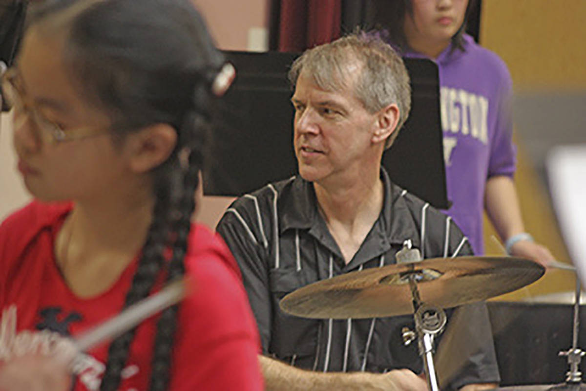 Gary Gibson, Steel Magic Northwests executive, artistic director and founder, leads the steel drum performances. MARK KLAAS, Kent Reporter