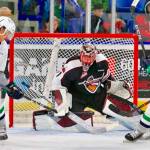 The Thunderbirds Jarret Tyszka, left, fires a shot at Giants goalie Todd Scott during WHL play Tuesday night. COURTESY PHOTO, Richard Fedyck