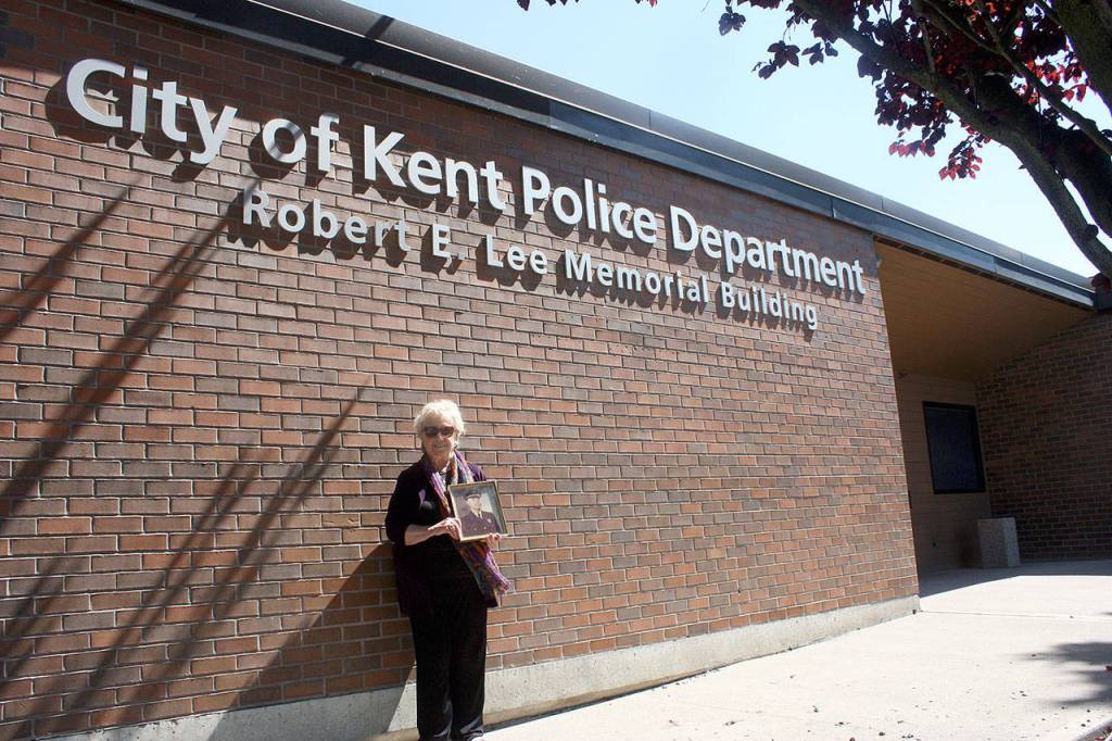 Vicki (Lee) Schmitz stands in August next to the Kent Police building before city officials added Chief in front of her fathers name of Robert E. Lee. FILE PHOTO, Kent Reporter