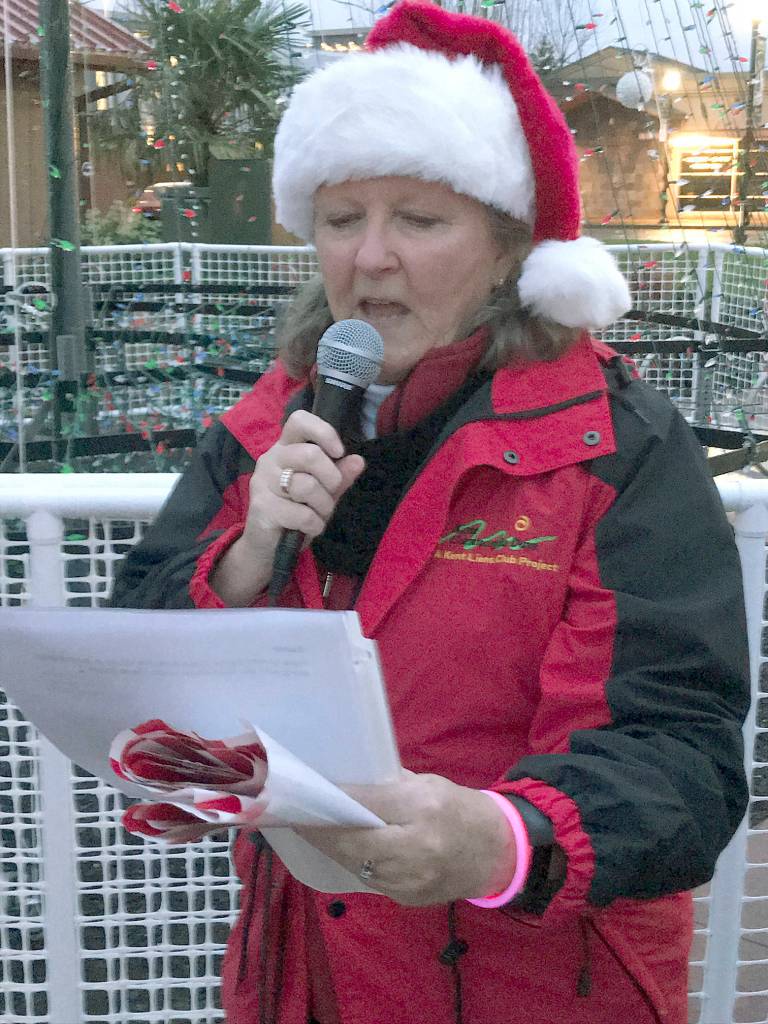 Patty Sikora of the Kent Lions Club talks to the crowd about the holiday program. MARK KLAAS, Kent Reporter