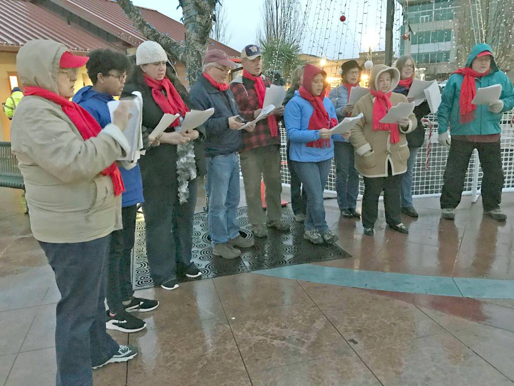 Kent Lutheran Church carolers lead a sing-a-long of Christmas carols in the square. MARK KLAAS, Kent Reporter