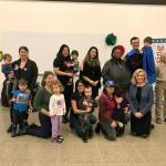 Sen. Joe Fain, standing with his son, Moxon, joins families for the celebration at Green River College on Sunday. COURTESY PHOTO, MomsRising