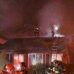 Local firefighters work to extinguish a Kent house fire early Monday morning. COURTESY PHOTO, Puget Sound Regional Fire Authority