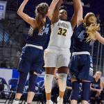 Kentridges Jordyn Jenkins fires a shot over Central Valleys Lacie Hull, left, and Hailey Christopher during action in the King Showcase on Monday. RACHEL CIAMPI, Kent Reporter