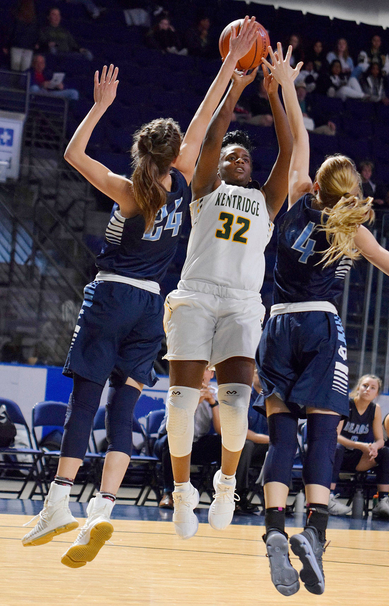 Kentridges Jordyn Jenkins fires a shot over Central Valleys Lacie Hull, left, and Hailey Christopher during action in the King Showcase on Monday. RACHEL CIAMPI, Kent Reporter