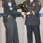 Kent Police Sgt. Joe Gagner, left, receives a plaque from Assistant Police Chief Derek Kammerzell on Monday at City Hall to honor him after his 33 years of service. COURTESY PHOTO, Kent Police