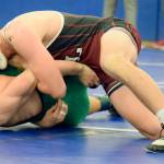Kentlakes Alex Lopez rides Kentwoods John Thompson during their 145-pound title bout at the North Puget Sound League Cascade Division League and sub-regional tournament last Saturday. RACHEL CIAMPI, Reporter
