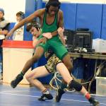 Kentridges William Sirbu tries to bring down Kentwoods Shawn Salomon during their 106-pound title match at the North Puget Sound League Cascade Division League and sub-regional tournament last Saturday. RACHEL CIAMPI, Reporter