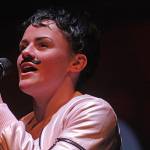 Ruby Robins, as Queens Freddie Mercury, performs a rendition of the late rock legends hit Somebody to Love during the Lets Dance for Heart program at the Kentridge Performing Arts Center on Friday. MARK KLAAS, Kent Reporter