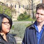Paul Meng, an Auburnite and rally organizer, right, joins LaDonna Horne on the City Hall Plaza at a vigil for her son on Saturday. MARK KLAAS, Auburn Reporter