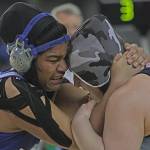 Kent-Meridian freshman Ofa He Lotu Tuifua, left, clashes with Mount Rainiers Giuliana Pepe for the 190-pound championship at Mat Classic XXX on Saturday. MARK KLAAS, Kent Reporter