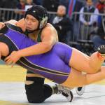 Kentwoods Sabrina Perez, top, takes on Highlines Caylee Collins for the 170-pound title. RACHEL CIAMPI, Kent Reporter