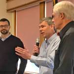 Rep. Pat Sullivan, D-Covington, fields a question from the audience as Sen. Joe Fain, R-Auburn, left, and Mark Hargrove, R-Covington, look on during a District 47 town hall meeting at the Golden Steer Steak N Rib House in Kent last Saturday. MARK KLAAS, Kent Reporter