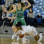 Kentridges Morgan Gary stumbles as she collects the ball in front of Woodinvilles Alena Coomar. KAYSE ANGEL, Reporter