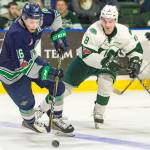 Thunderbirds center Noah Philp handles the puck with the Silvertips Patrick Bajkov defending during WHL play Saturday night in Everett. COURTESY PHOTO, Brian Liesse, T-Birds