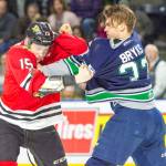 The Thunderbirds Graeme Bryks, right, scuffles with the Winterhawks John Ludvig during WHL play Sunday. COURTESY PHOTO, Brian Liesse, T-Birds